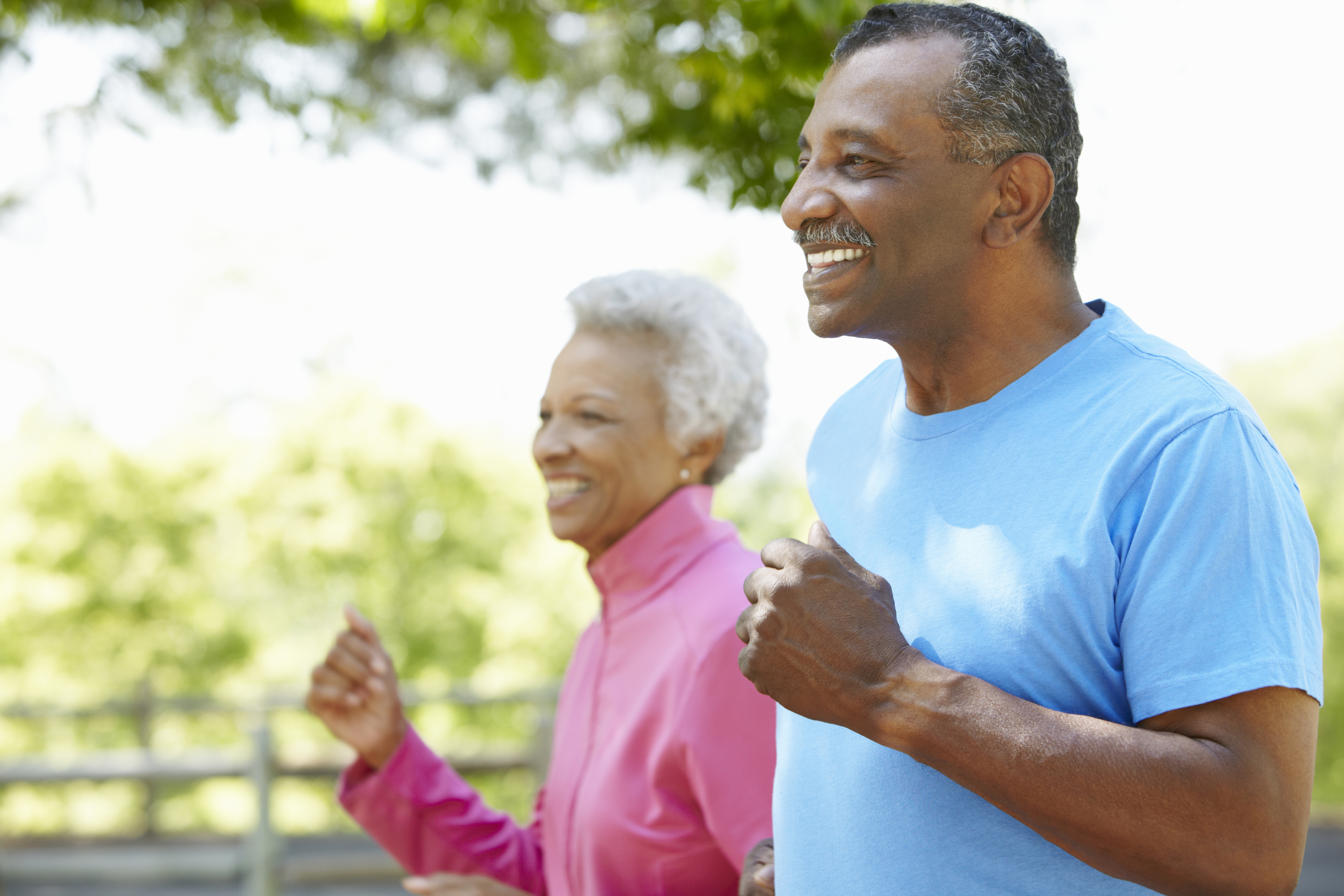 Mature African American man and woman walking