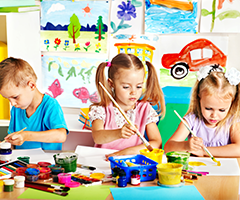 Three children painting