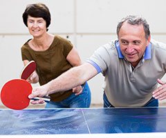 Senior playing ping pong