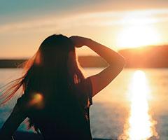 Woman looking at sunset