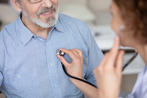 Physician using a stethoscope