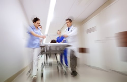 Healthcare Providers Rushing a Patient Through the Hallways of a Hospital