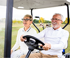 Older people driving golf cart