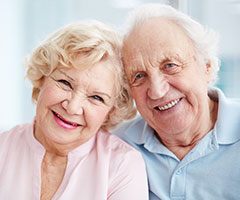 Two older people smiling