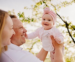 Mother and Father holding baby