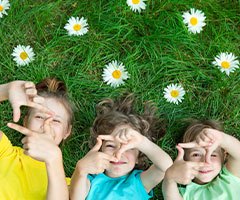 Children laying in grass