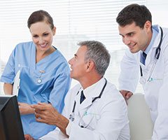 Two physicians and a nurse conversating