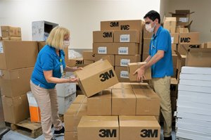 Volunteers unloading delivery