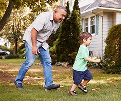 Man playing with little boy