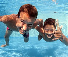 Two boys in swimming pool