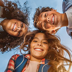 children looking down at camera