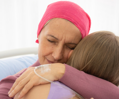Cancer patient hugging child