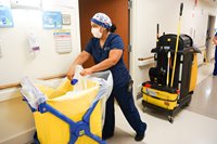 A Nurse Cleaning a Patient Room