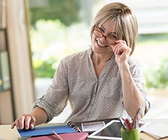 Woman smiling with notebook