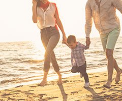 Family walking on beach