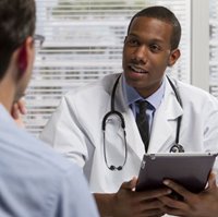 Physician talking to patient