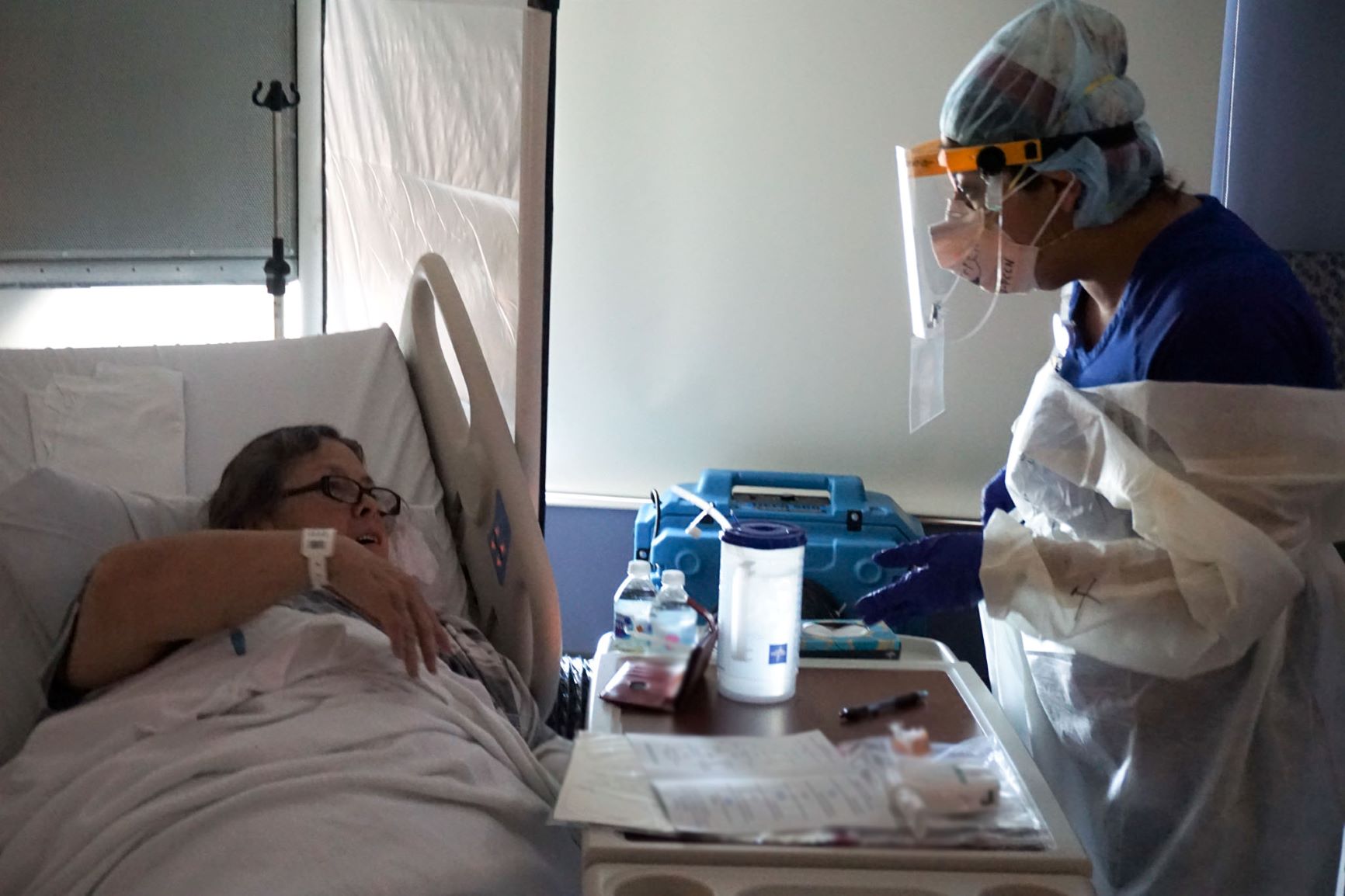 Sherri Parmar, a Gulf Coast Medical Center nurse, shares a laugh with a patient.