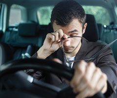 Tired driver behind the wheel