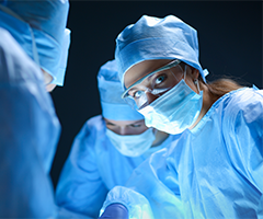 Surgeons preforming surgery