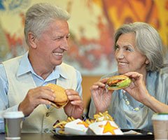 older couple eating food