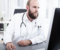 Physician using computer