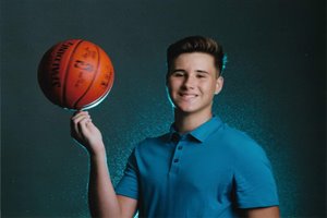 Young boy holding basketball