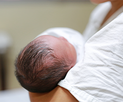 Mother holding newborn baby