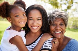 Grandmother, Mother and Daughter smiling
