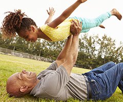 Man playing with little girl