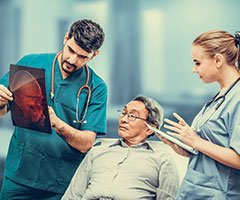 Patient reviewing brain scans