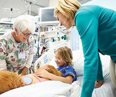 Dorian comforting pediatric patient