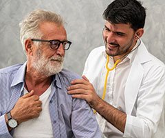 Physician with older patient