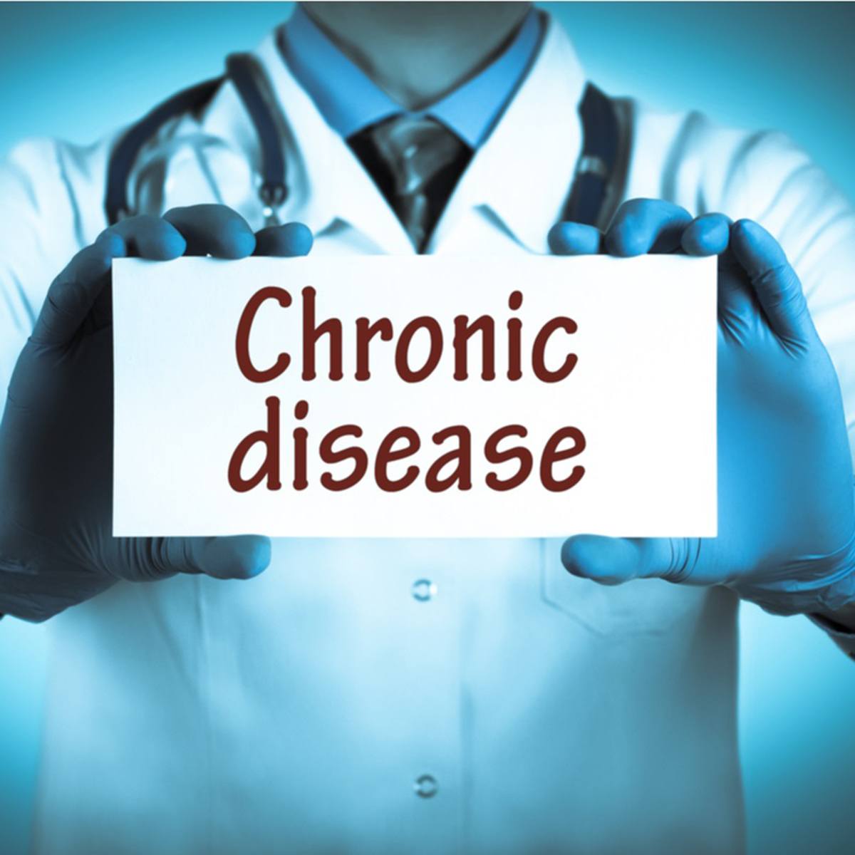 Doctor holding "chronic disease" card