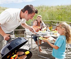 Dad grilling, family cookout