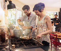 Man and woman cooking food