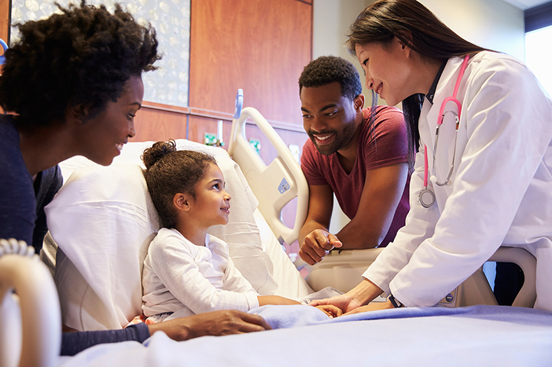 Diverse Family and doctor visiting pediatric patient