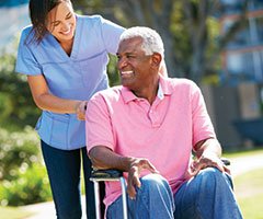 Man in Wheelchair with Volunteer