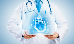 Physician holding a holographic heart. 