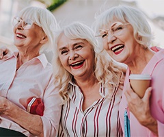 Three senior women laughing