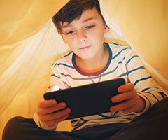 Child playing on smart device