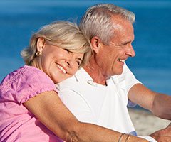 Senior man and women hugging