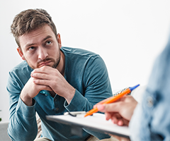 Patient listening to physician