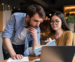 Concerned couple looking at computer