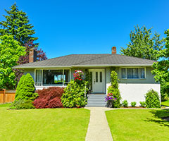 House with greenery in front