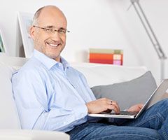 Man browsing on laptop